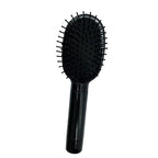 Brosse à cheveux noire avec manche long, accessoire de coiffure discret pouvant servir de cachette secrète.
